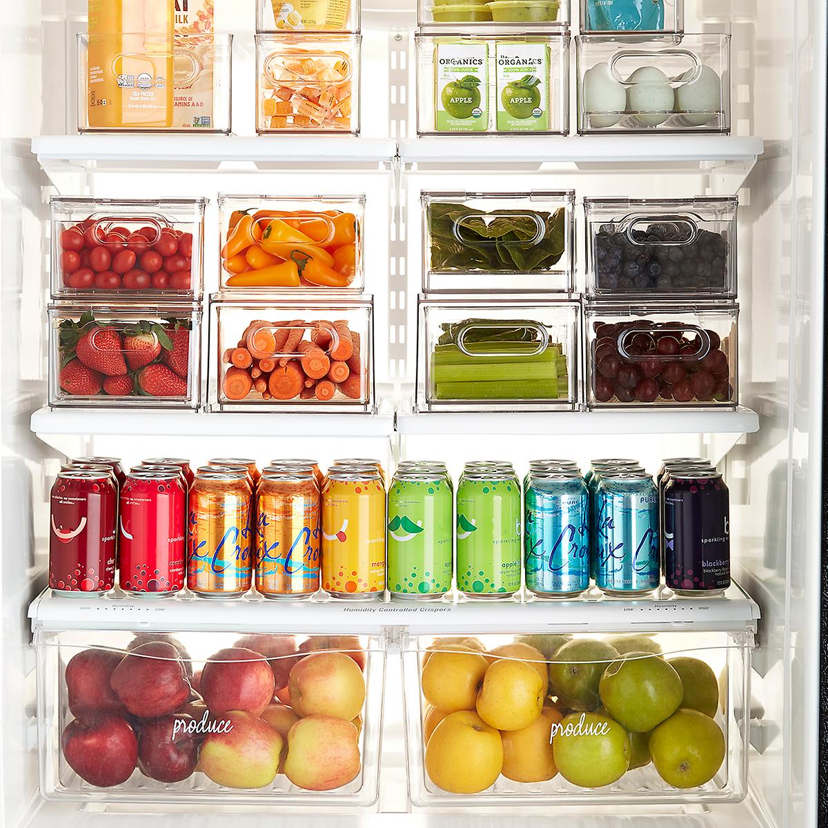 This sleek all-purpose bin can be the secret to effortless refrigerator organization. Perfectly modular to make the most of shelf space, it's completely clear so contents are always viewable. A removable divider lets you sort small jars, snacks, fruit cups, individual yogurts and more. Integrated handles make it easy to grab and go. Ideal for use in both the freezer and the refrigerator, each bin is also extremely durable and stacks securely with The Home Edit Fridge Drawer, Egg Bin or Produce Bin. Made from exceptionally durable clear Resipreme plastic Modular and stackable with or without lid; fits counter-depth refrigerators Includes removable divider; NOT dishwasher-safe, please hand-wash Only at The Container Store The Grouped Large Divided Fridge Bin